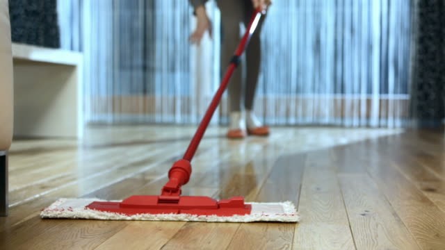 Damp mops used for cleaning hardwood floor