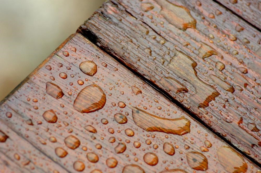 Drops of water on wooden planks.