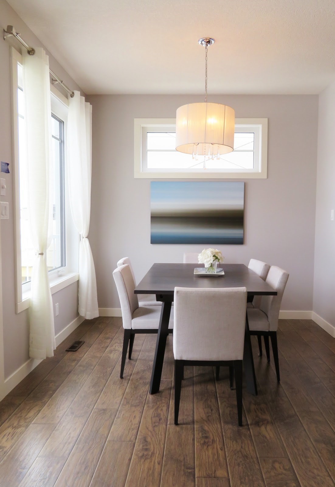a dining room with wooden floors