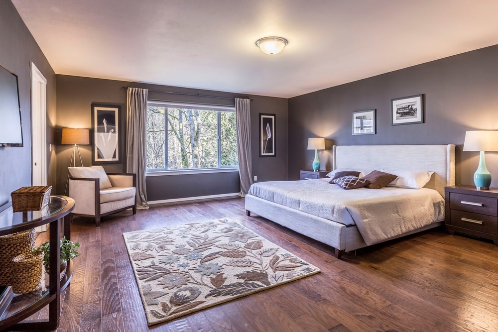 A cozy bedroom with wooden floors
