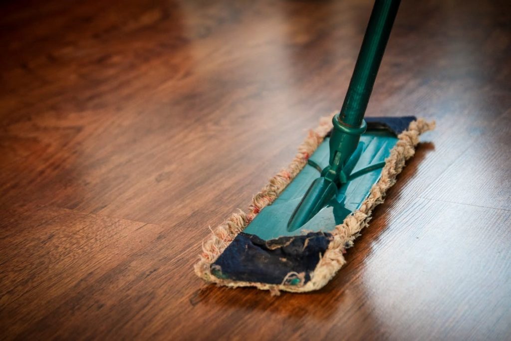 A hardwood floor being mopped