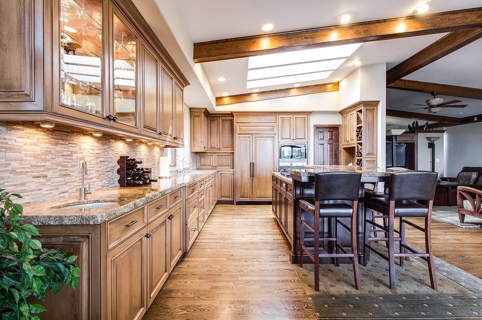 Light colored hardwood flooring in a kitchen.