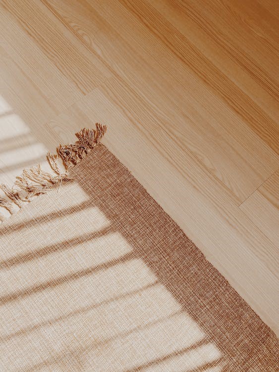 A rug placed on a hardwood floor
