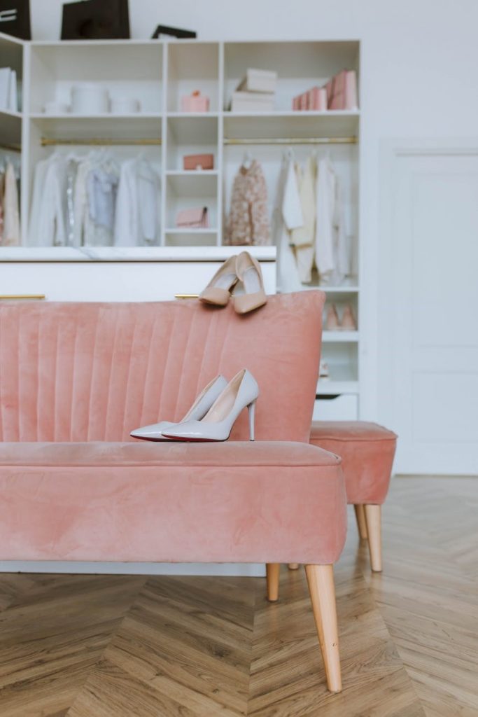 luxurious pink sofa on a patterned wooden floor