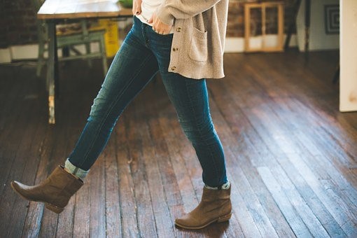 A person walking on hard wood floor