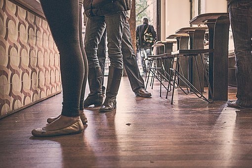 People standing on hardwood floor