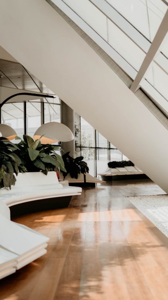 A spacious room with broad hardwood strips.