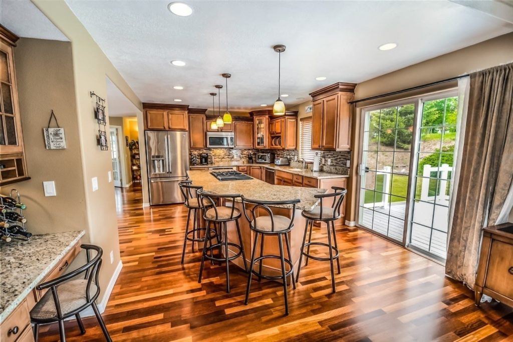 A kitchen with hardwood floors