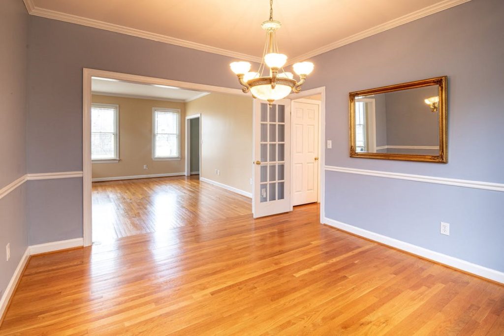 A room with refinished hardwood floor