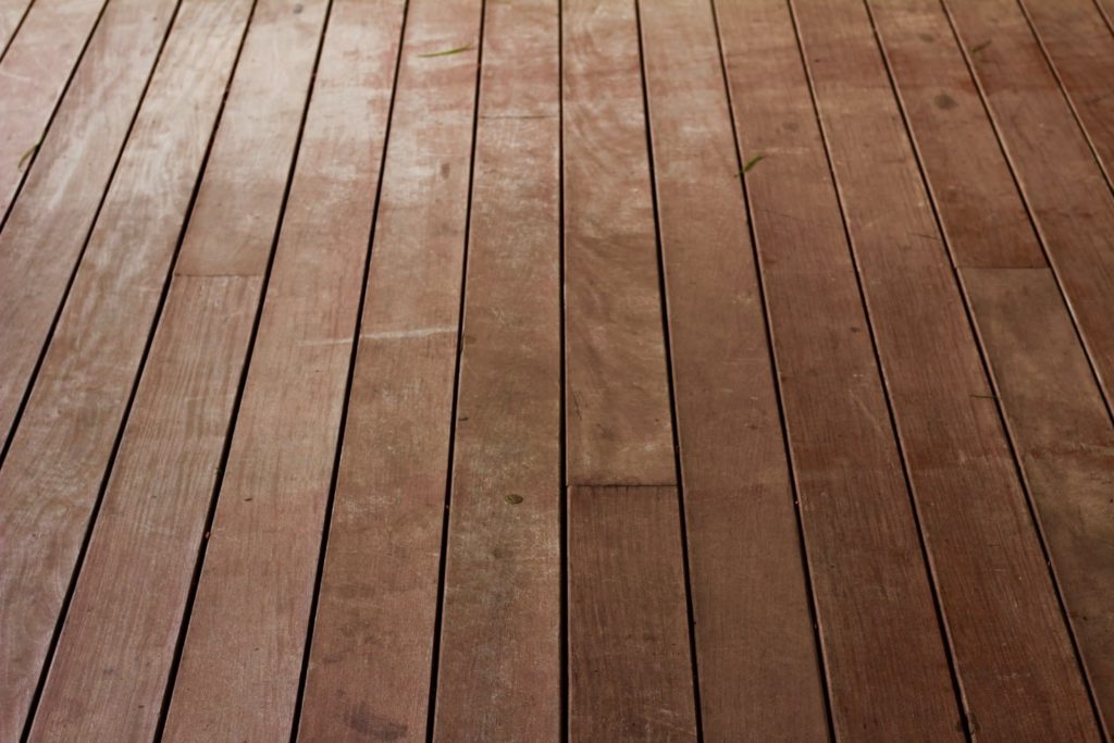 Dark wood flooring panels.