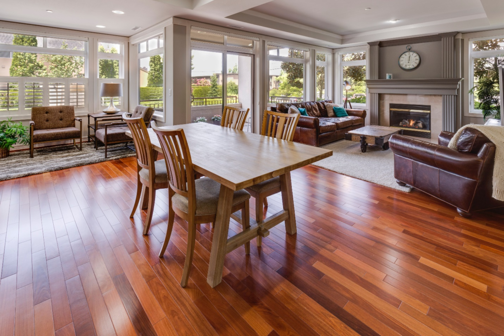 Brown table and chairs near sofa.