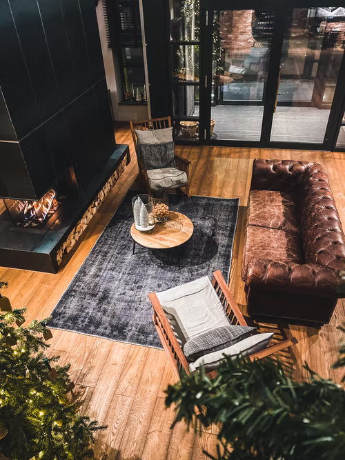 Living room with grey carpet on a hardwood floor