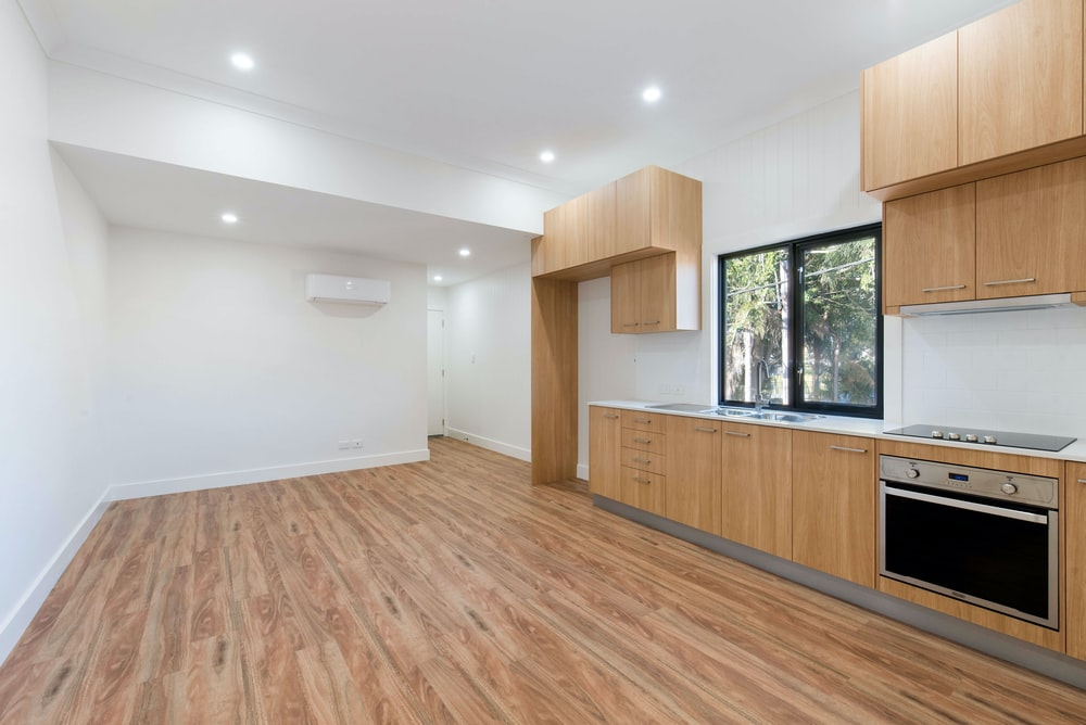 A kitchen with hardwood flooring