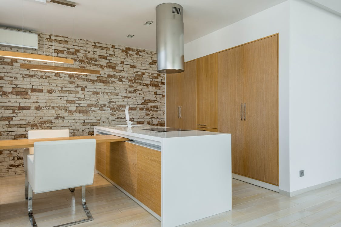 A kitchen with hardwood flooring installed