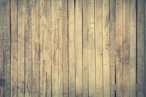 An old and worn-out hardwood flooring