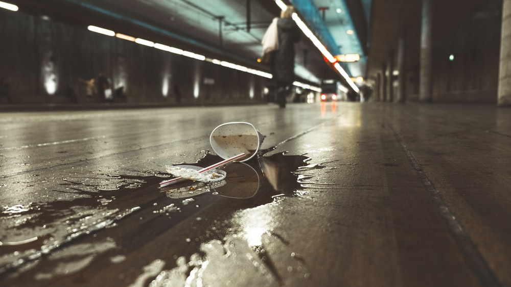 White Styrofoam cup spilled on the floor