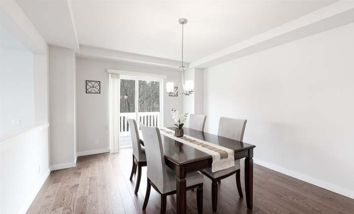 A dining room with furniture and waterproof floor