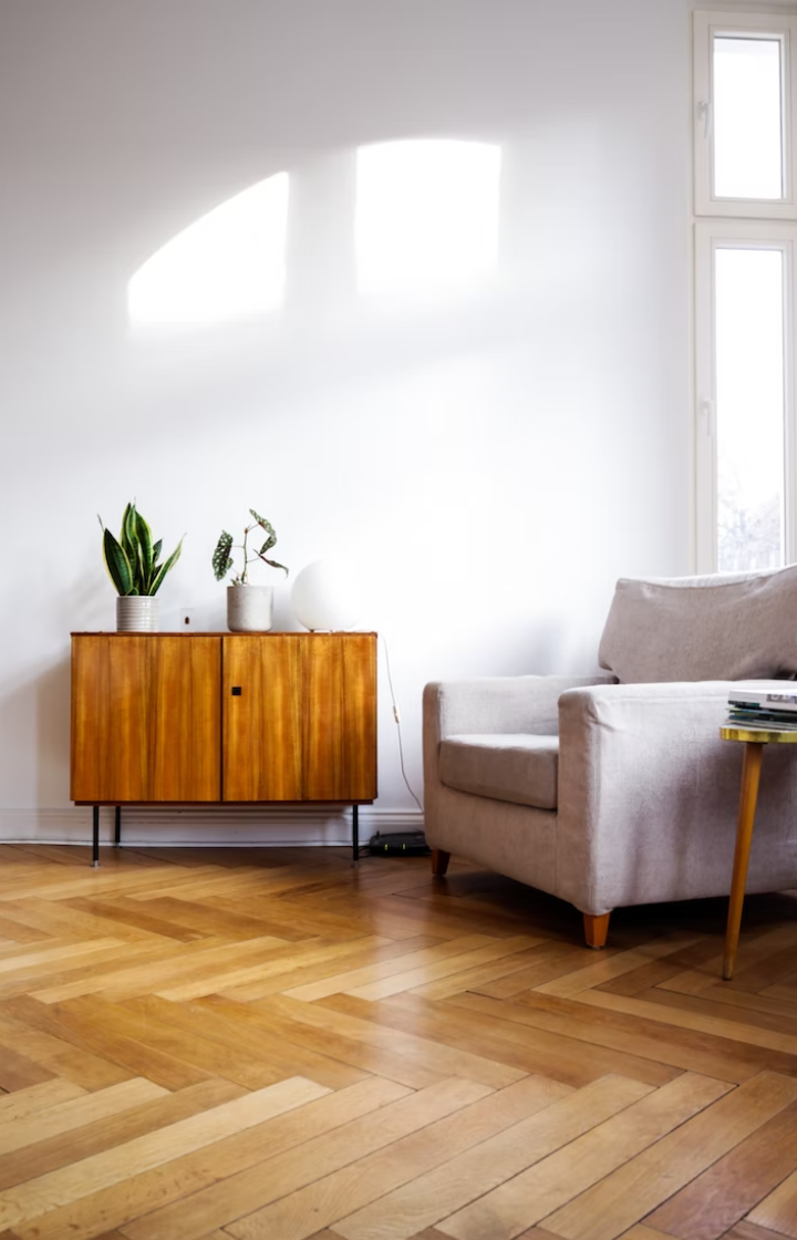 A couch and table on a laminate floor