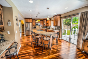 Modern kitchen showcasing a glossy hardwood floor finish.