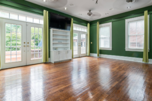 Spacious room with newly refinished hardwood flooring.
