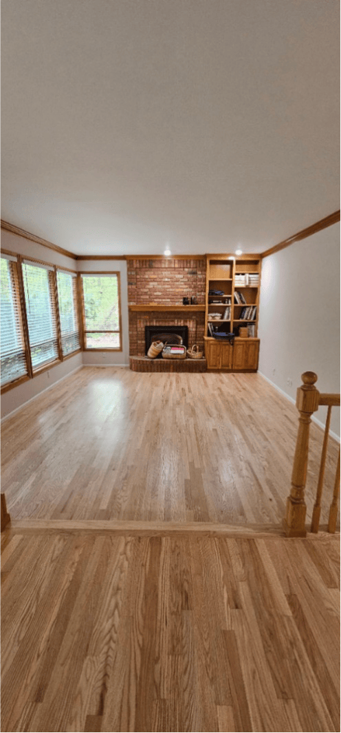 An empty room with a wood floor