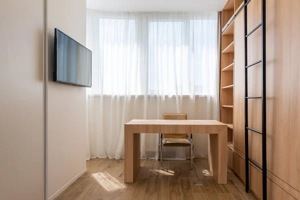Stylish wooden ladder shelves complementing wood flooring in a cozy interior.