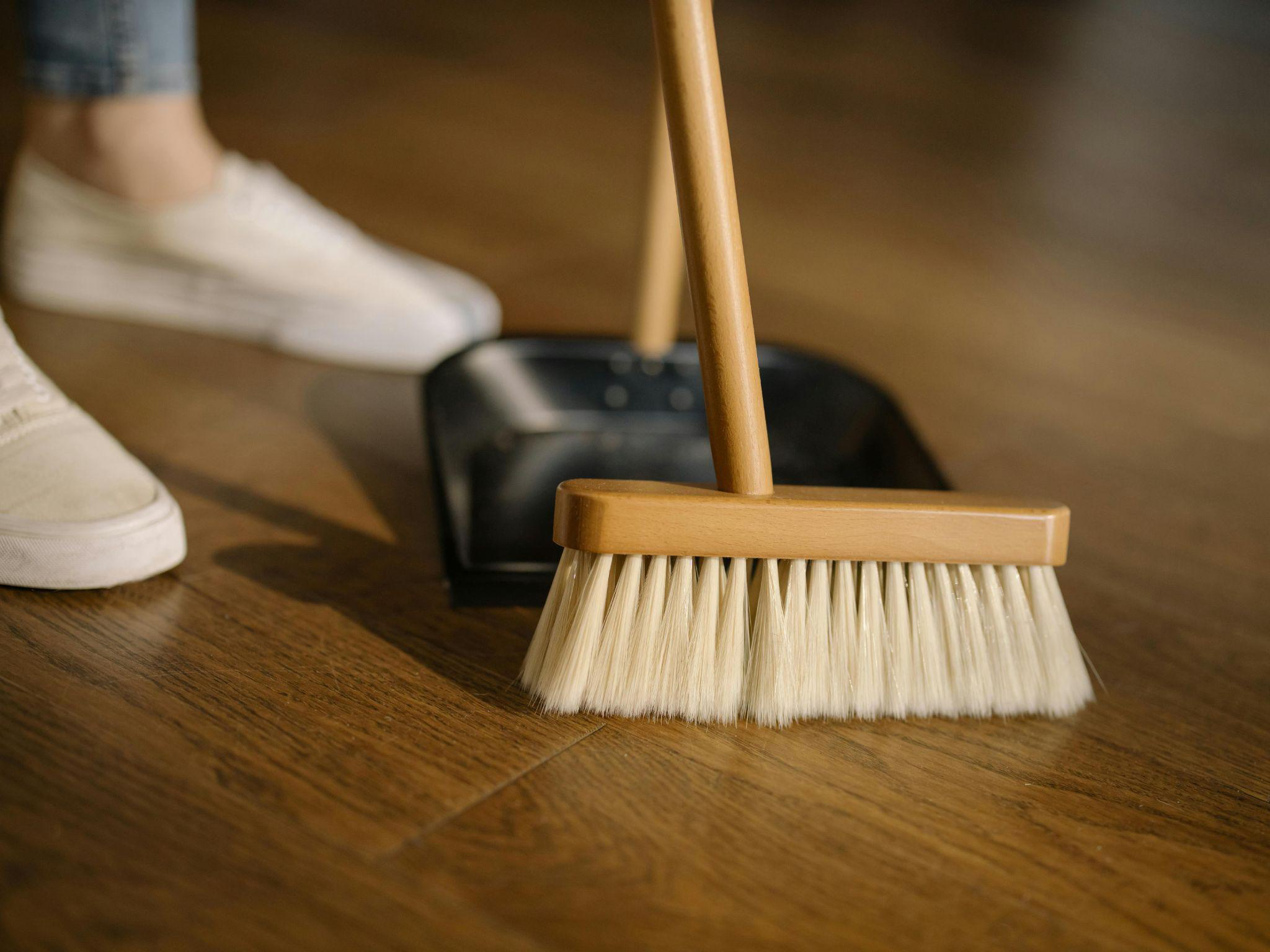 Someone dusting the floor